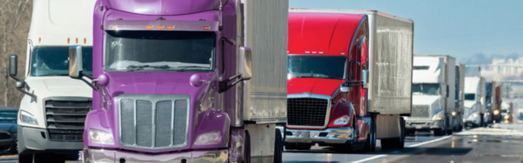 convoy of semi trucks on road