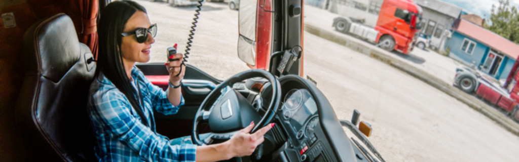 woman in cab of semi truck talking on cb radio
