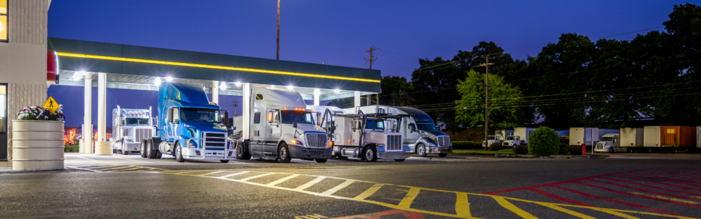 Truck stop with semi trucks parked in stalls