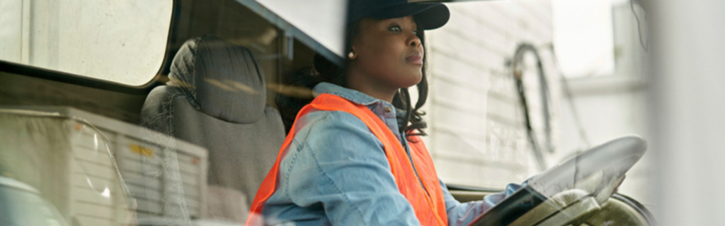 black woman driving semi truck