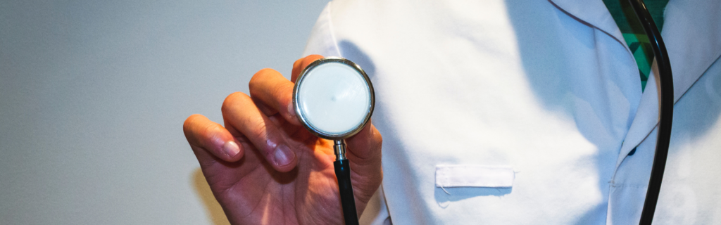 doctor holding up stethoscope