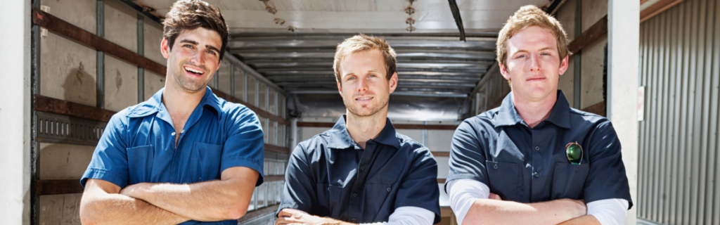 three blue collar men