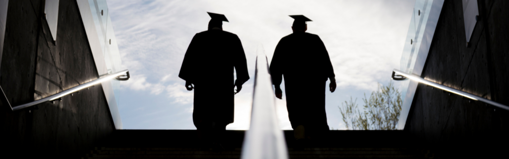 graduates walking up stairs