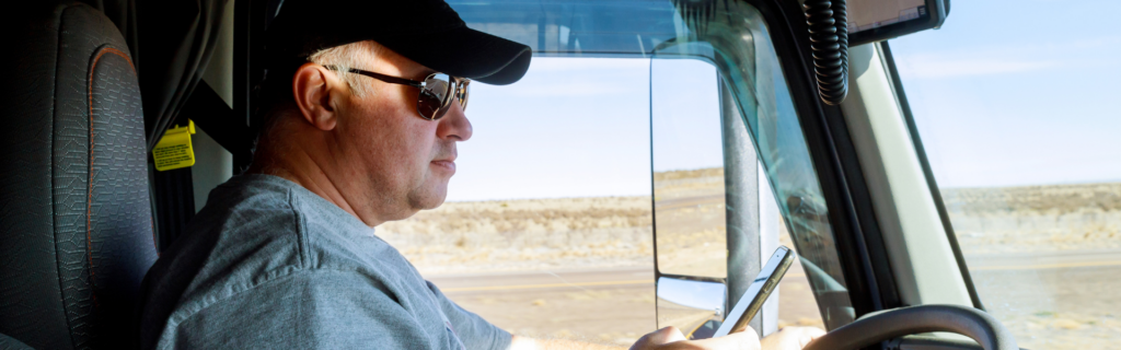 truck driver looking at phone