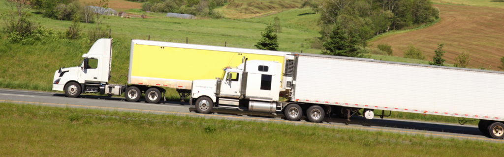 two semi trucks on road
