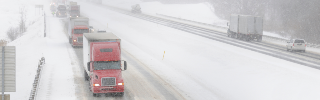 snowy interstate highway with semi trucks