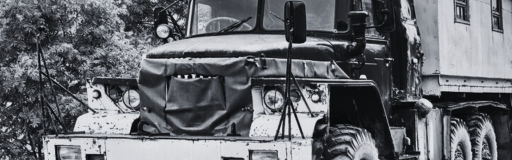 black and white photo of antique semi truck