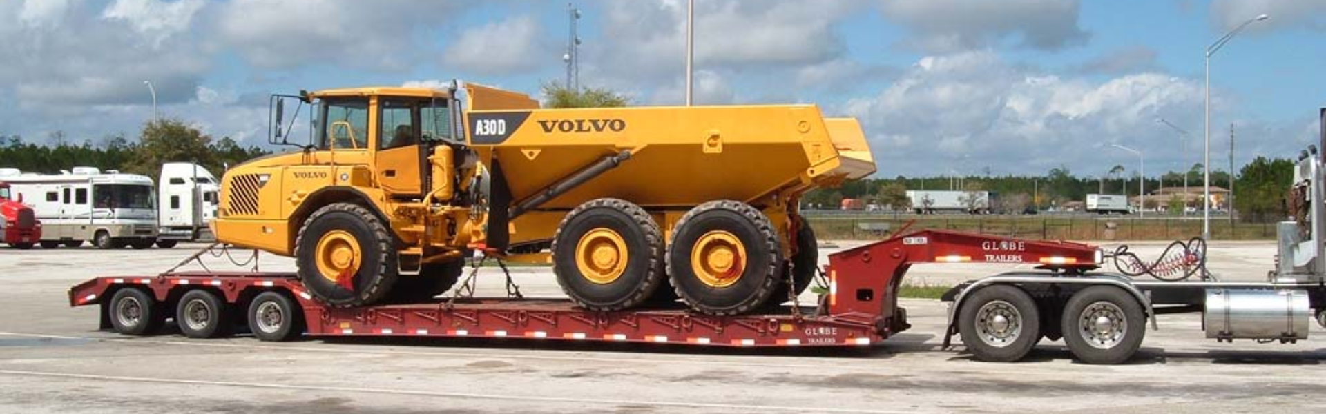 Navigating the Road Less Traveled: The Thrills of Low Boy Flatbed Driving