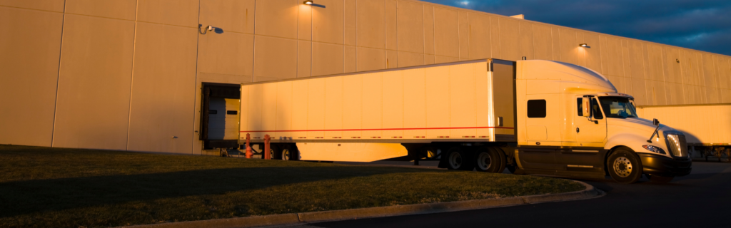 semi truck backed up to loading dock