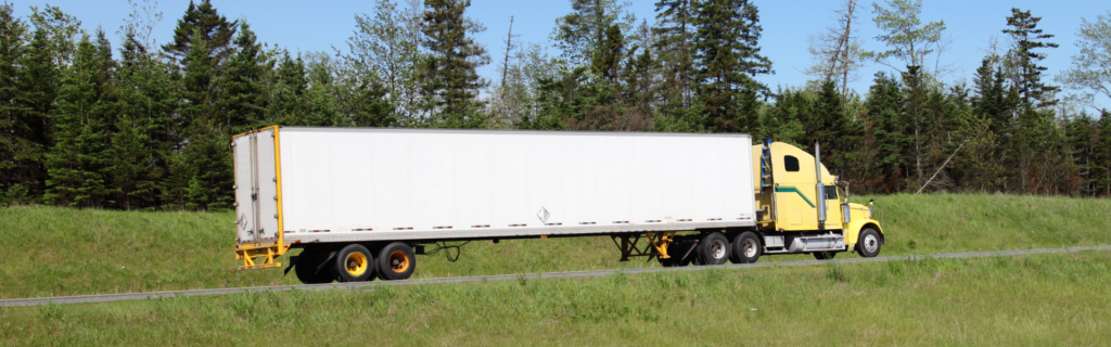 yellow semi with white trailer