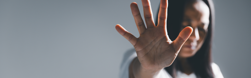 Woman with hand up