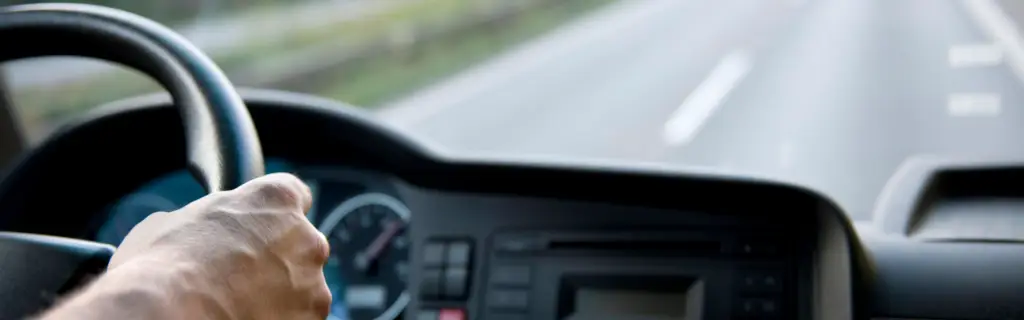 semi truck cab looking out over open road