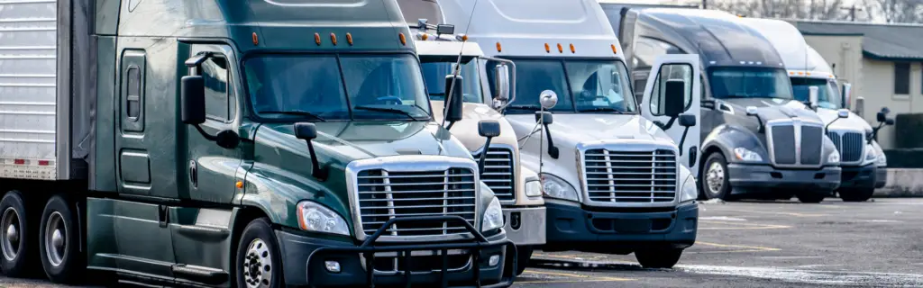parked semi trucks in parking lot