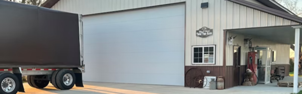 garage with semi truck parked in front - source Overdrive
