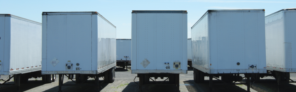 parked semi truck trailers