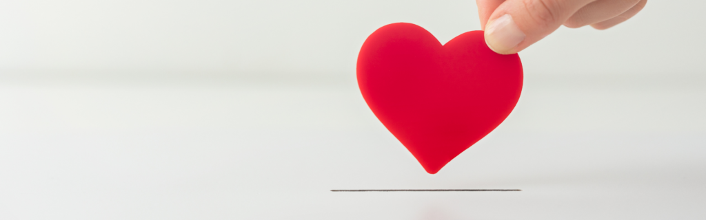 hand placing heart in slot