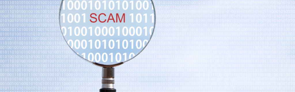 magnifying glass highlighting the word scam