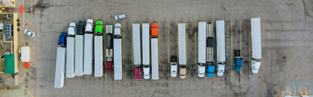 parked semi trucks in semi truck parking lot : The federal government is investing $4.2 billion in infrastructure, creating 260 new truck parking spaces through grants from the Bipartisan Infrastructure Law.