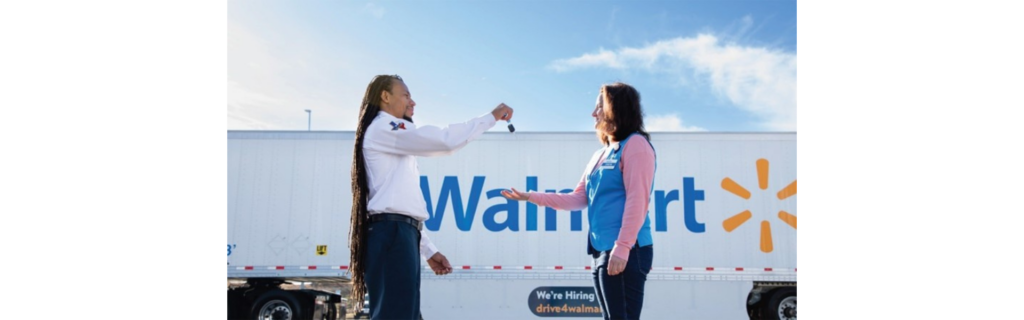 Two people standing in front of a walmart truck. Walmart expands its innovative Associate-to-Driver program, offering associates a streamlined path to earn a CDL and join Walmart’s Private Fleet.