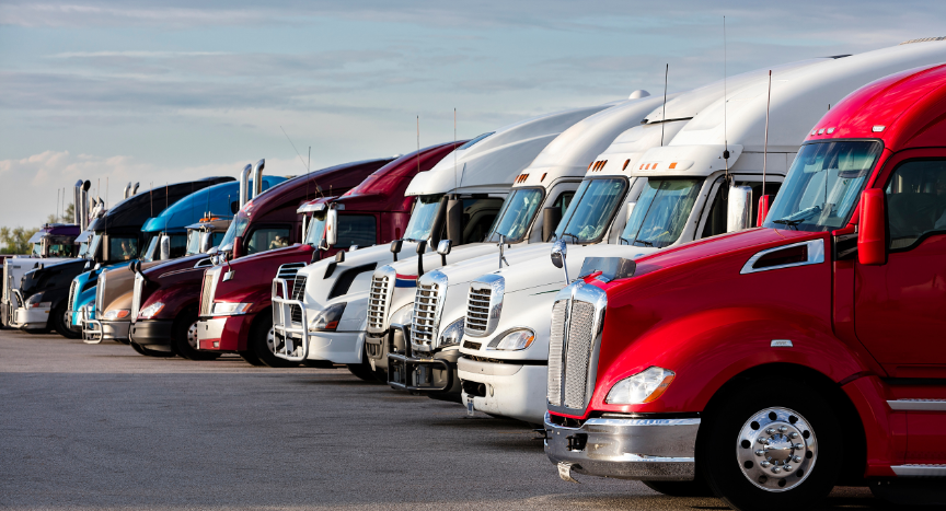 Learn why some freight corridors experience tougher truck parking conditions and how warehouse growth, port activity, manufacturing, and seasonal freight influence parking availability.